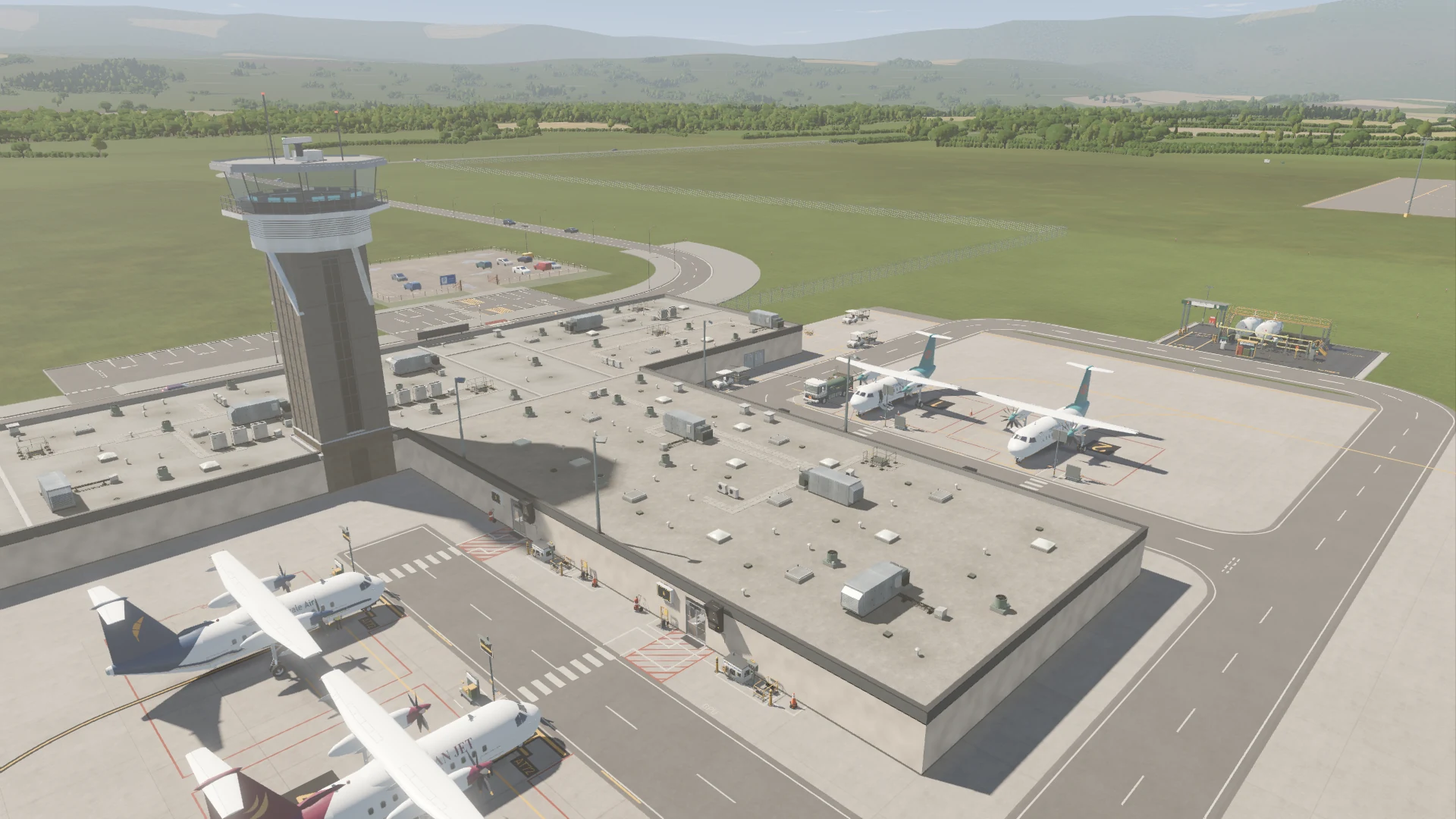 An aerial view of the Terminal, control tower, aircraft stands and surrounding countryside